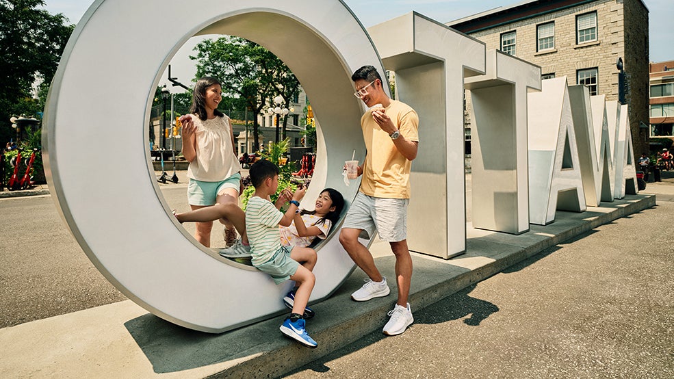 Family visit the Ottawa Sign in the ByWard Market