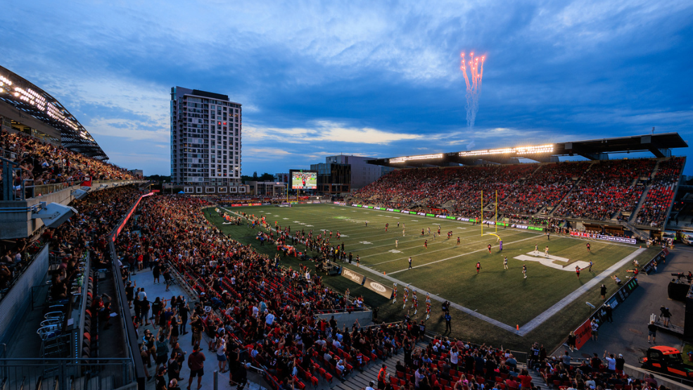 TD Place Stadium with full crowd and fireworks in the distance