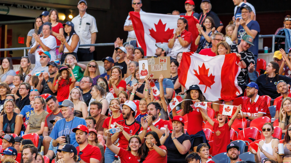 Crowd of passionate fans with Canada-themed attire and swag at TD Place World Rugby Pacific Four Series