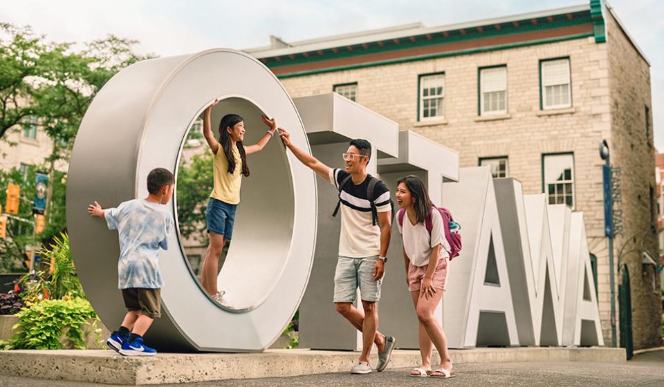 Family visit the Ottawa Sign in the ByWard Market